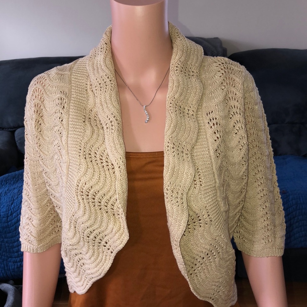 INC tan cover up with gold flex throughout.